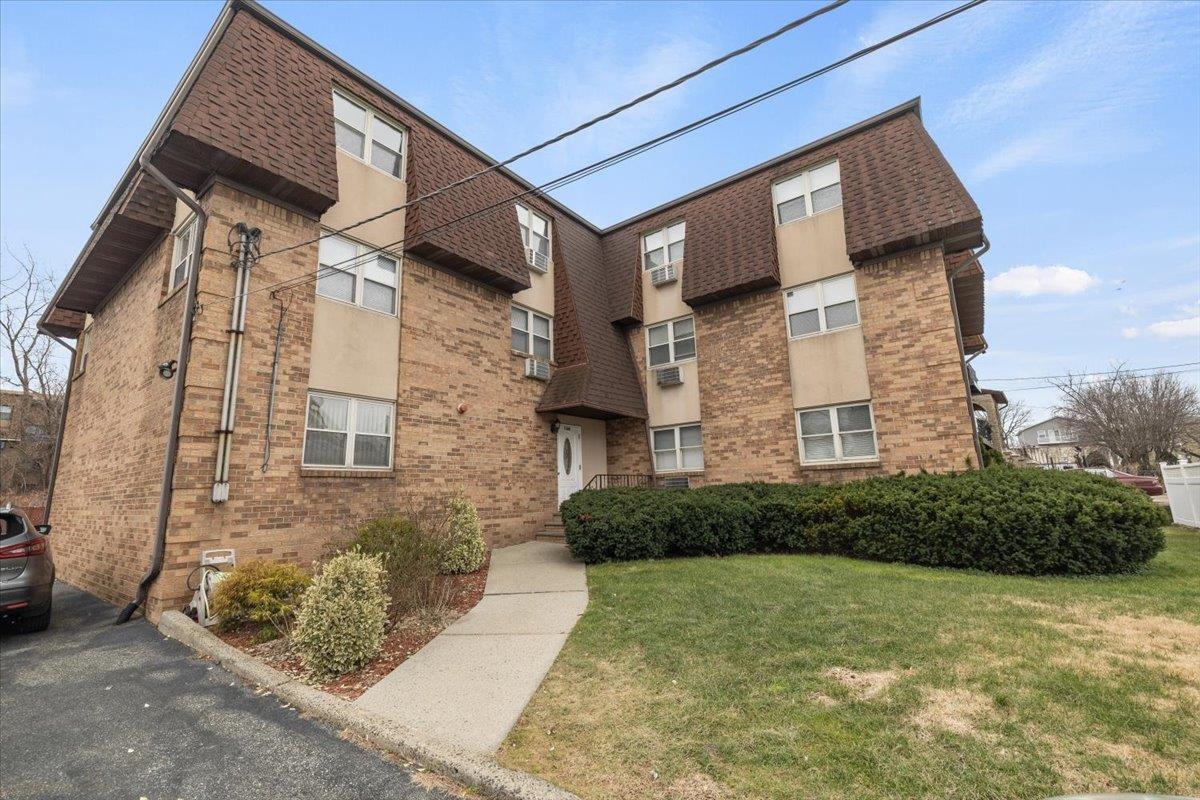 1138F Farm Road, Unit B Secaucus, NJ 07094 - Photo 19 of 20 a brick building with a yard