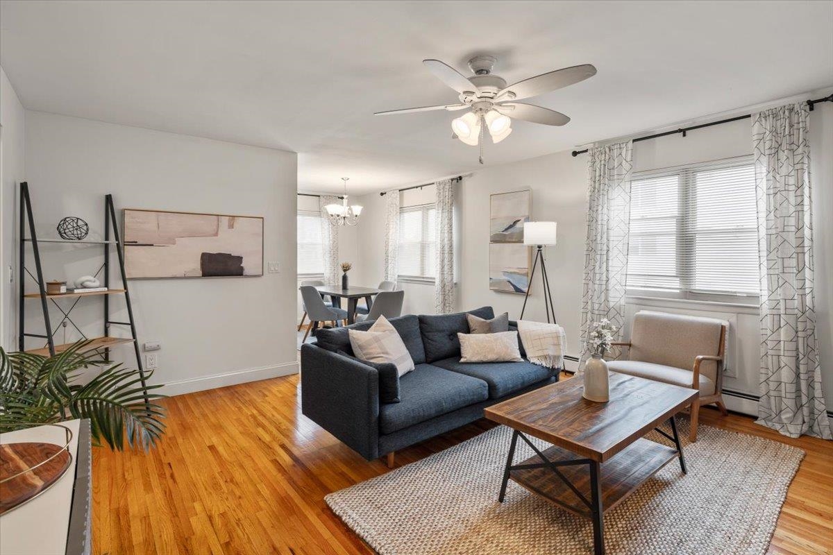 1138F Farm Road, Unit B Secaucus, NJ 07094 - Photo 2 of 20 a living room with furniture and a large window