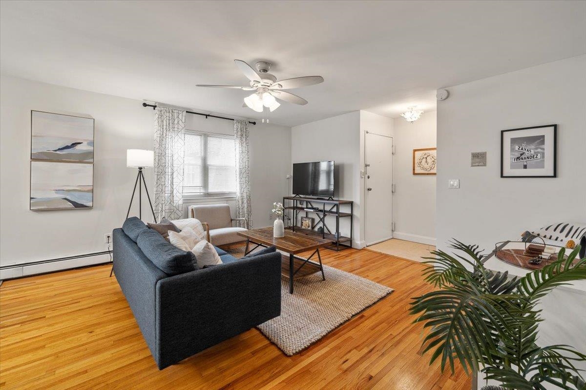 1138F Farm Road, Unit B Secaucus, NJ 07094 - Photo 4 of 20 a living room with furniture and a flat screen tv