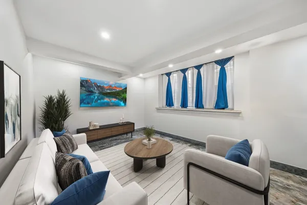 a living room with furniture and a rug