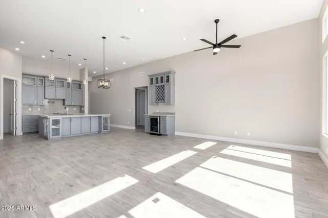 a view of a kitchen with furniture and a ceiling fan
