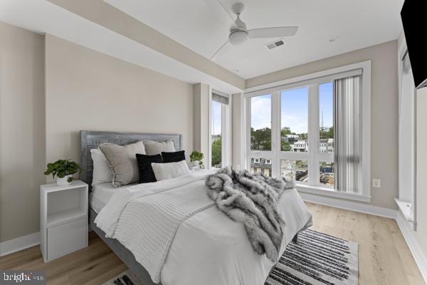 818 Kennedy Street Northwest, Unit 9 Washington, DC 20011 - Photo 10 of 23 a bedroom with bed and a large window