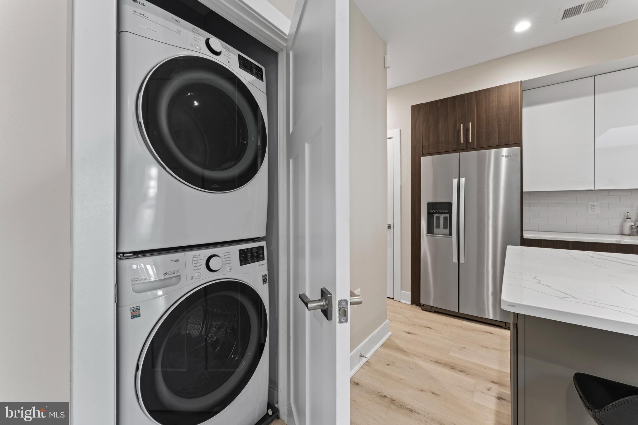 818 Kennedy Street Northwest, Unit 9 Washington, DC 20011 - Photo 9 of 23 a view of a kitchen with washer and dryer