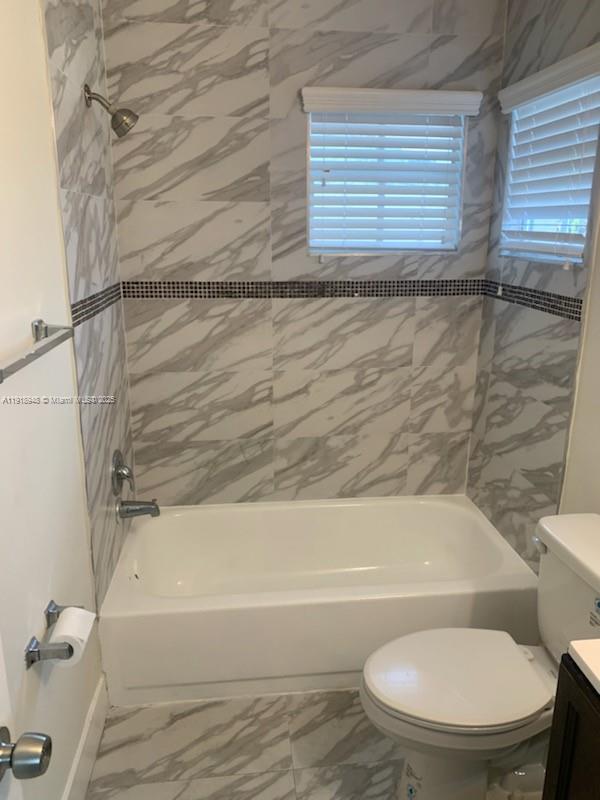 12309 Southwest 250th Street Homestead, FL 33032 - Photo 17 of 26 a bathroom with a toilet and a bathtub