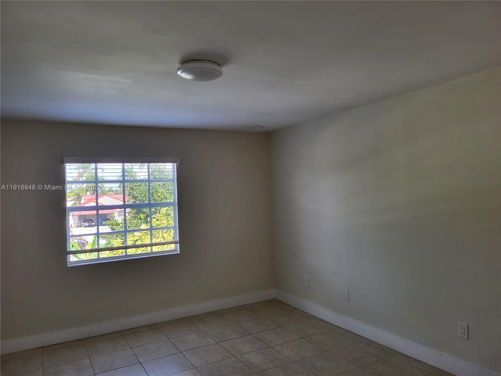 12309 Southwest 250th Street Homestead, FL 33032 - Photo 18 of 26 an empty room with a window
