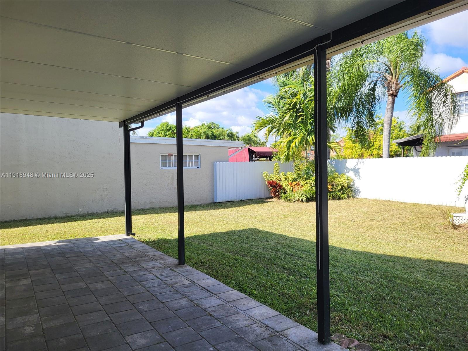 12309 Southwest 250th Street Homestead, FL 33032 - Photo 20 of 26 a view of a swimming pool with a porch