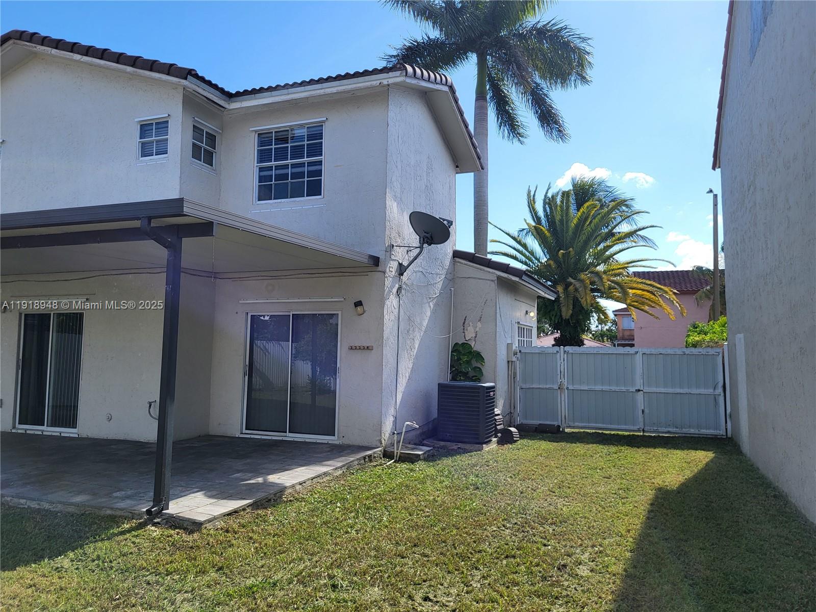 12309 Southwest 250th Street Homestead, FL 33032 - Photo 21 of 26 front view of a house with a yard