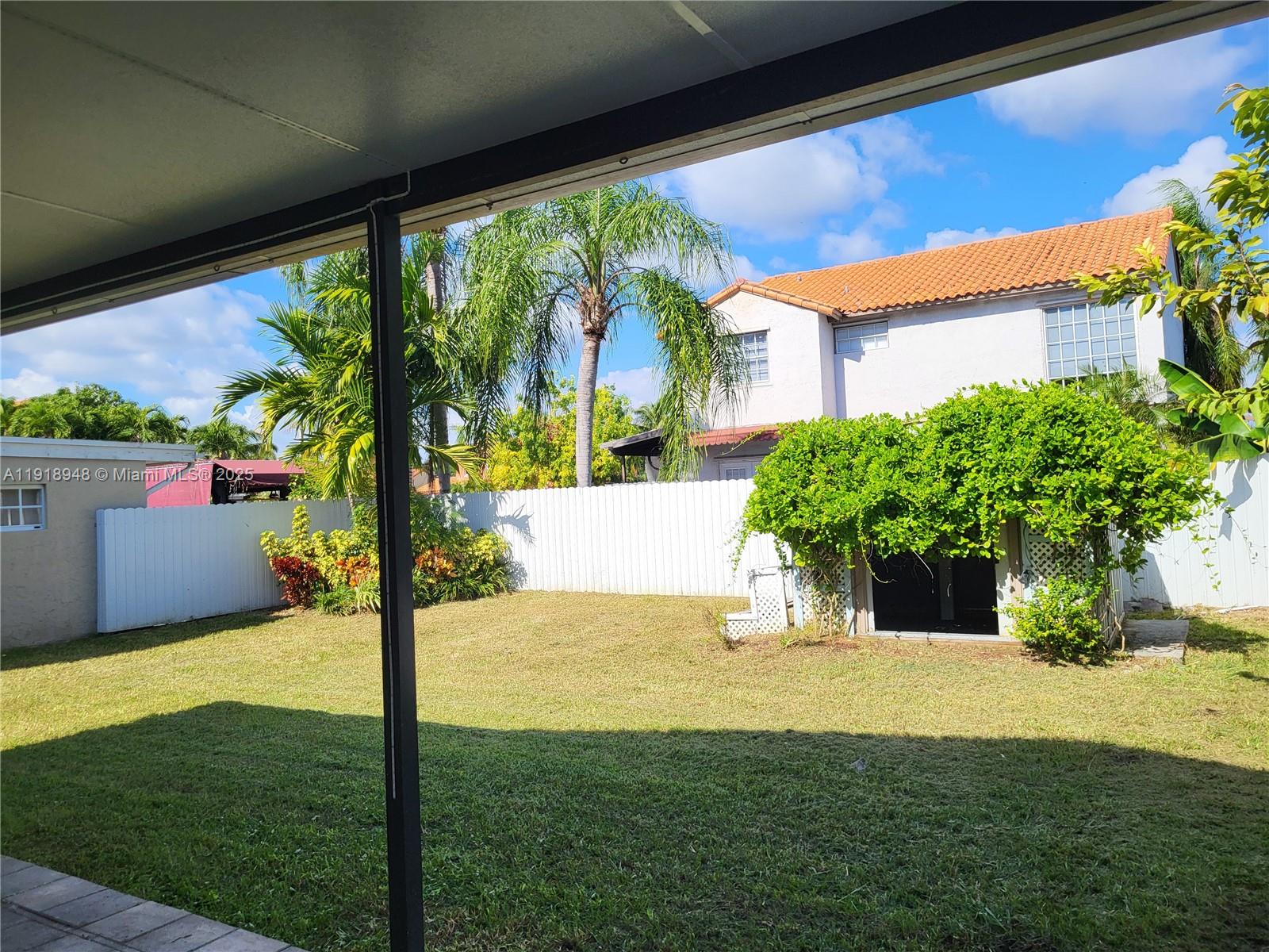 12309 Southwest 250th Street Homestead, FL 33032 - Photo 22 of 26 a view of an house with backyard porch and garden