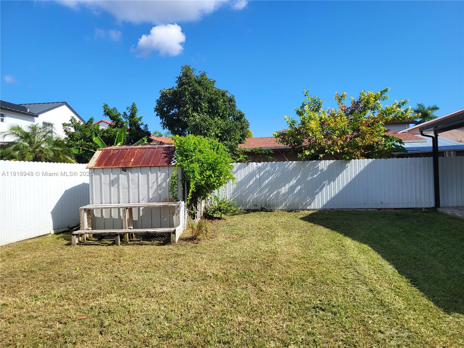 12309 Southwest 250th Street Homestead, FL 33032 - Photo 23 of 26 a backyard of a house with lots of green space