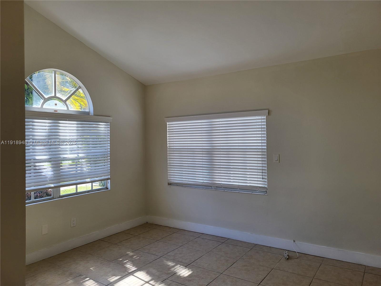 12309 Southwest 250th Street Homestead, FL 33032 - Photo 3 of 26 a view of an empty room with a window