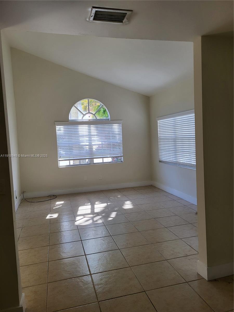 12309 Southwest 250th Street Homestead, FL 33032 - Photo 4 of 26 a view of a hallway with a window