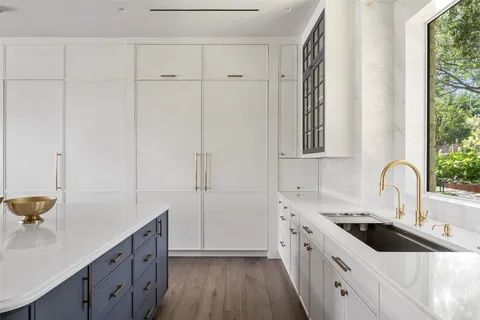 a kitchen with a sink and cabinets