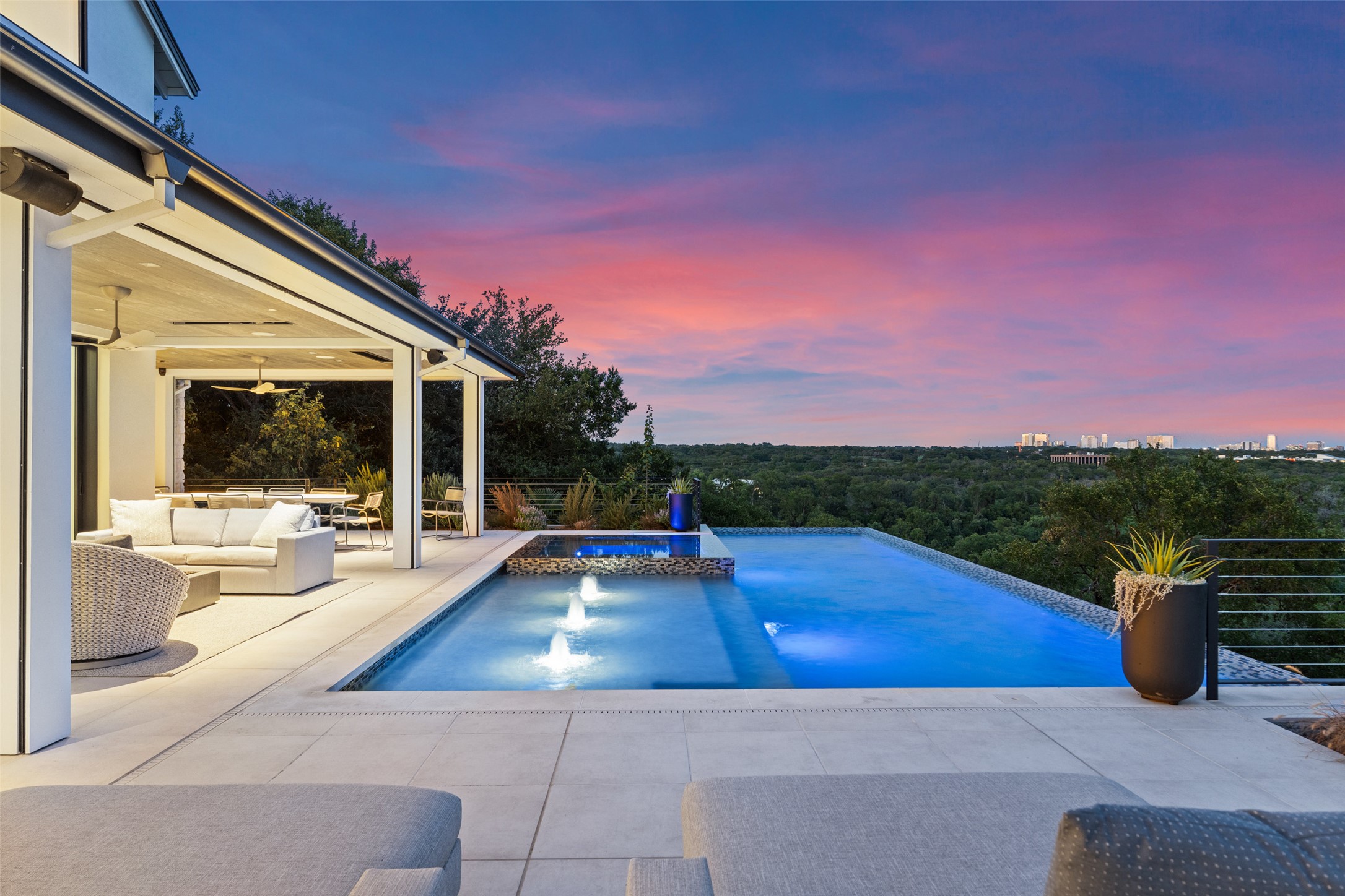 3111 Above Stratford Place Austin, TX 78746 - Photo 2 of 40 a view of a patio with swimming pool and table and chairs