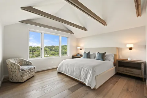 a bedroom with a bed and a couch