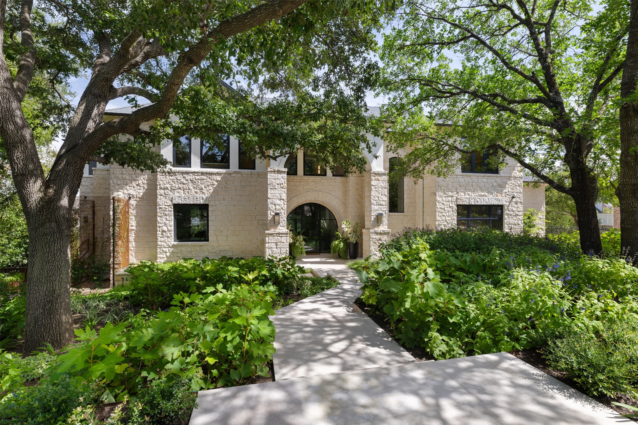3111 Above Stratford Place Austin, TX 78746 - Photo 39 of 40 a front view of a house with garden and trees