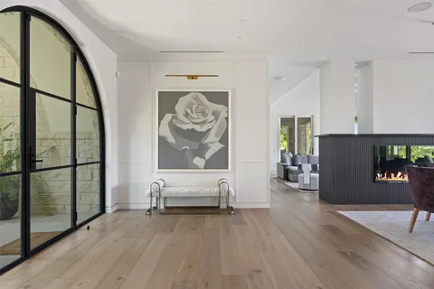 a view of an entryway with wooden floor