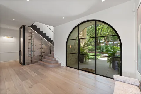 a view of an entryway with wooden floor