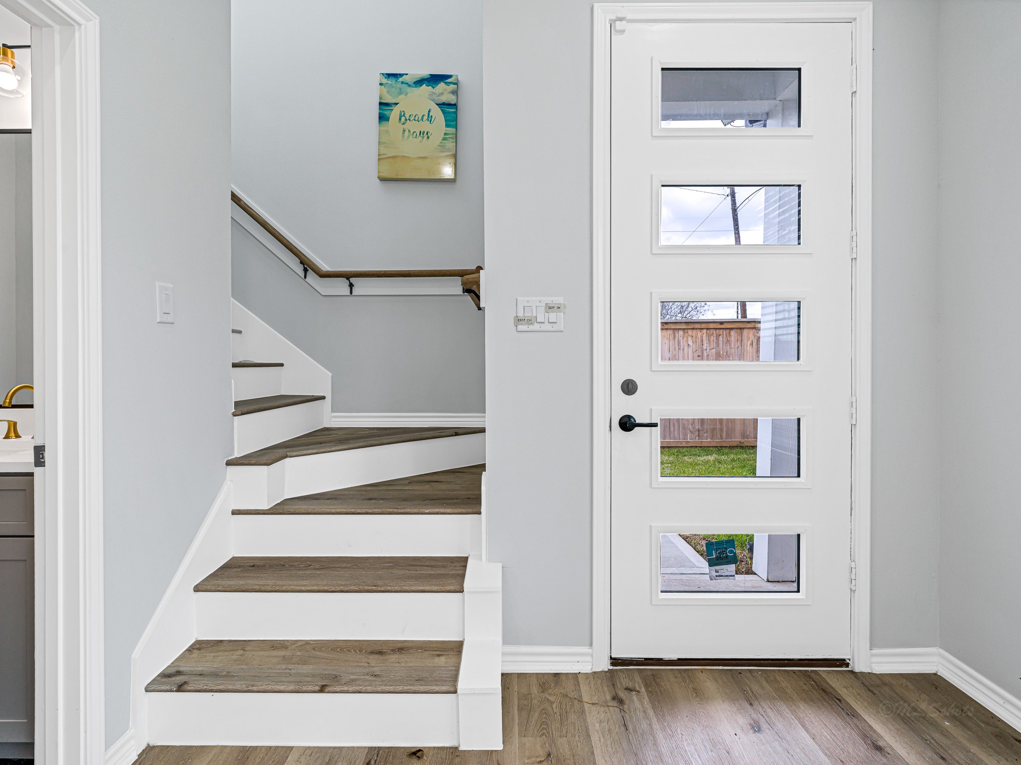 2720 Spence Street Houston, TX 77093 - Photo 19 of 30 a view of entryway with stairs and wooden floor
