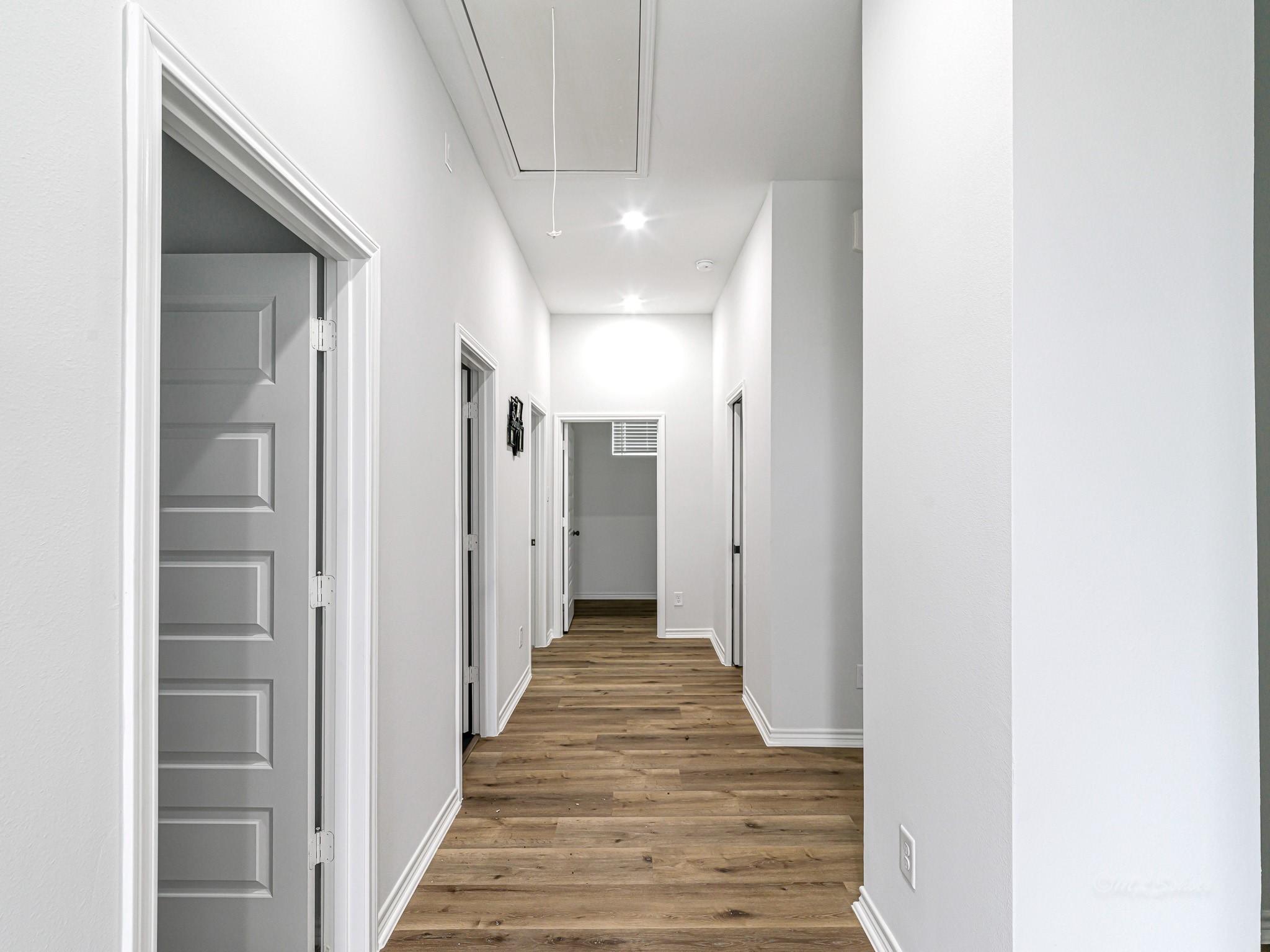2720 Spence Street Houston, TX 77093 - Photo 20 of 30 a view of a hallway with wooden floor