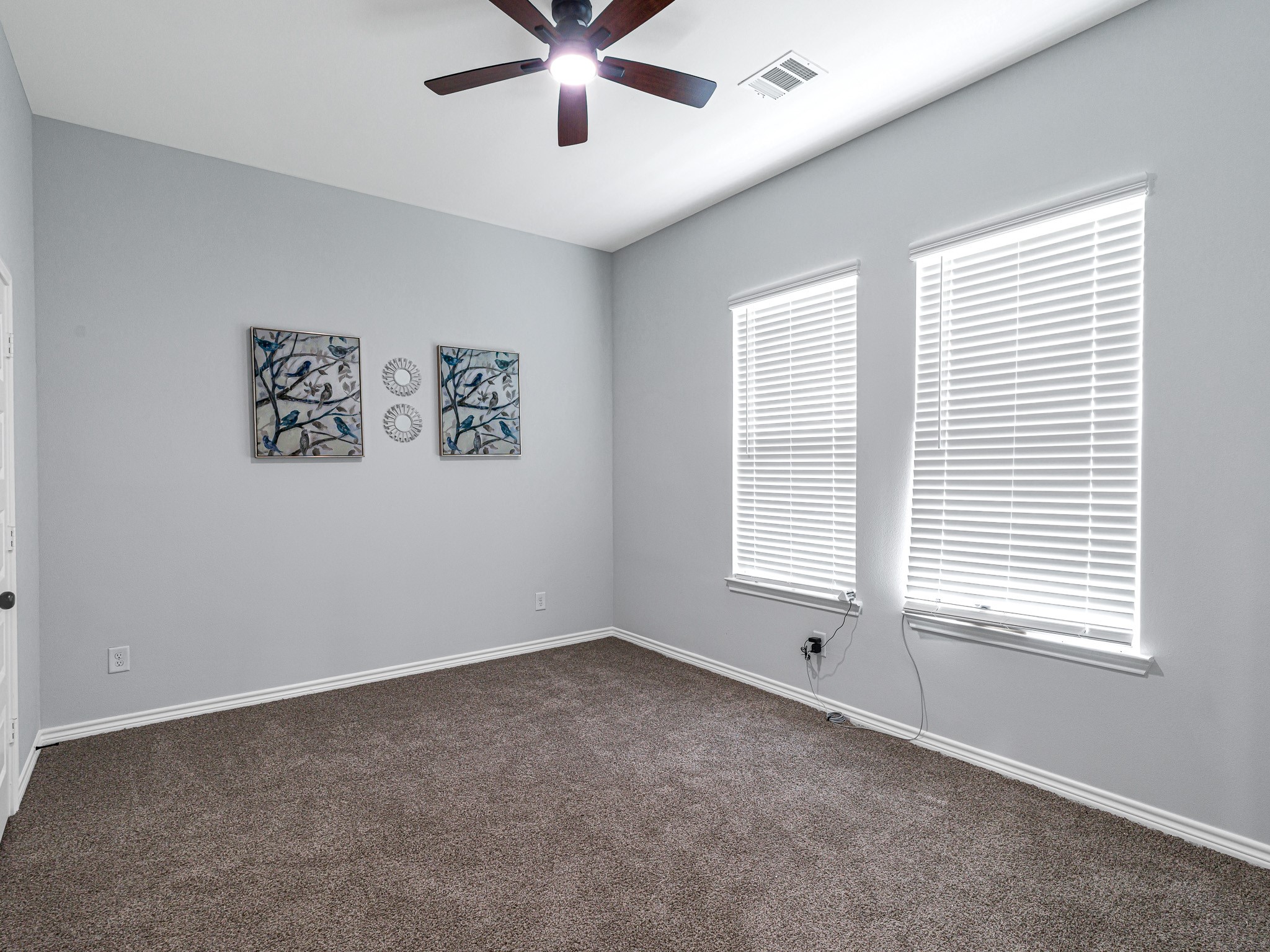 2720 Spence Street Houston, TX 77093 - Photo 27 of 30 a view of an empty room with a window and a ceiling fan