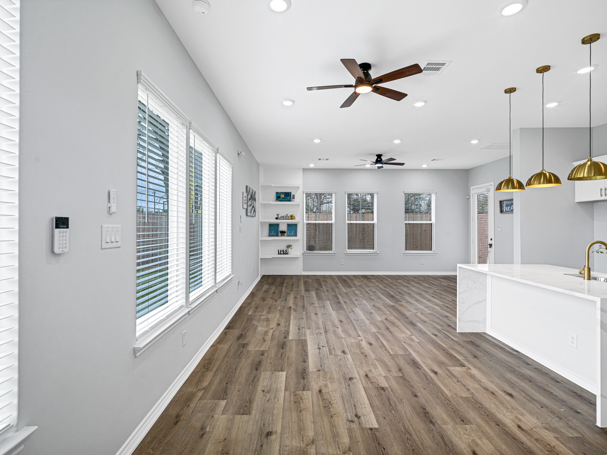 2720 Spence Street Houston, TX 77093 - Photo 8 of 30 a view of a room with a window and wooden floor