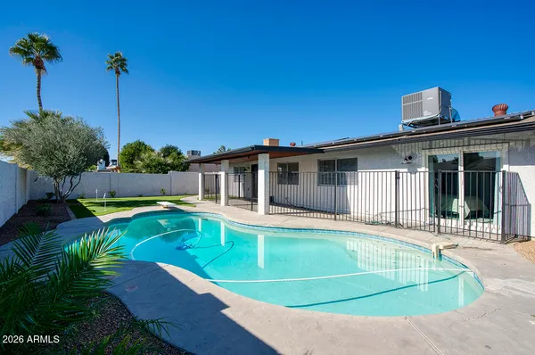 a view of a house with swimming pool