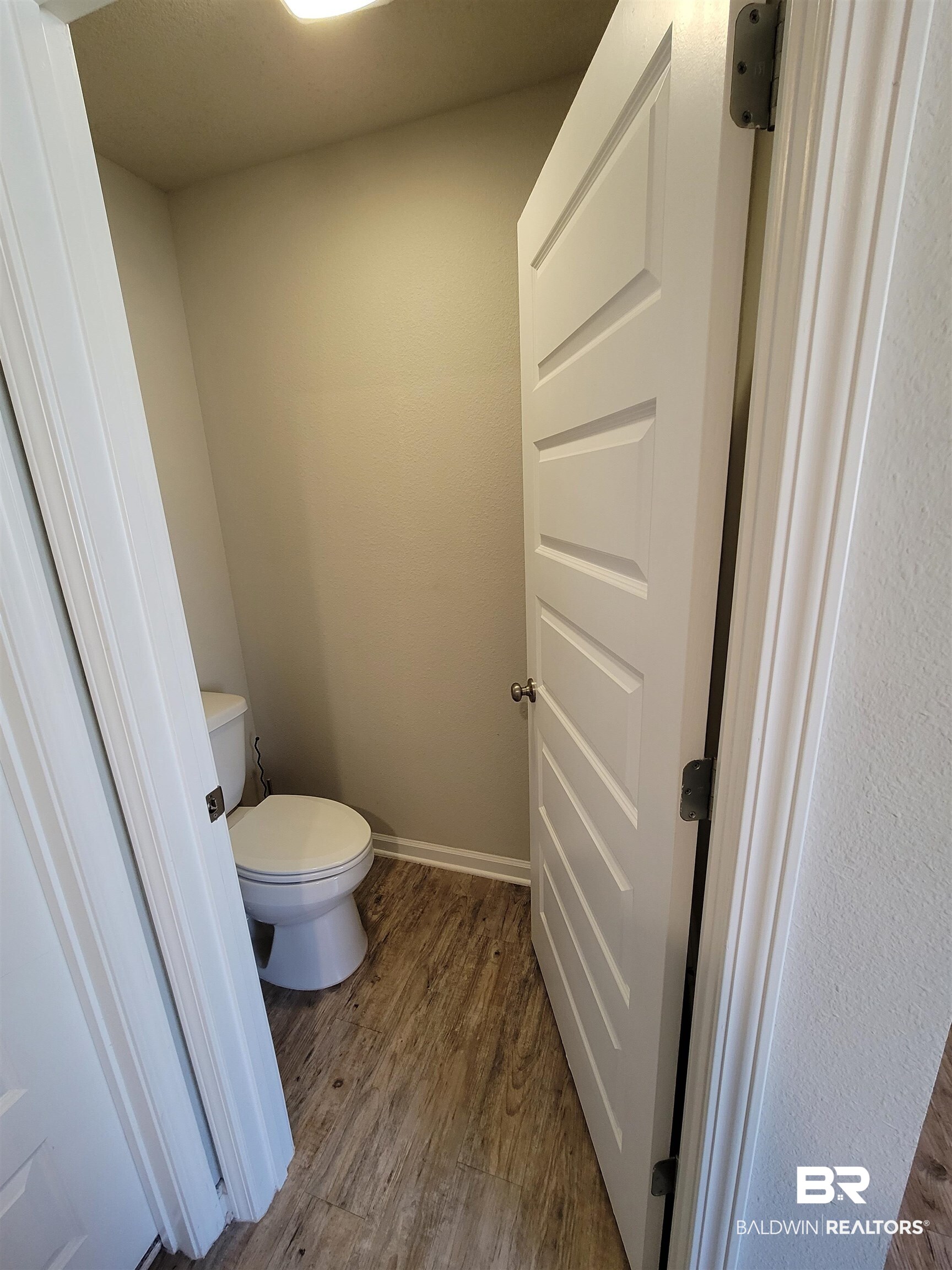 1305 Majesty Loop Foley, AL 36535 - Photo 21 of 24 Bathroom with dark wood-style flooring and toilet