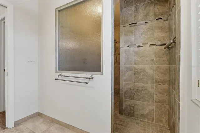 a bathroom with a granite countertop toilet sink and a bathtub