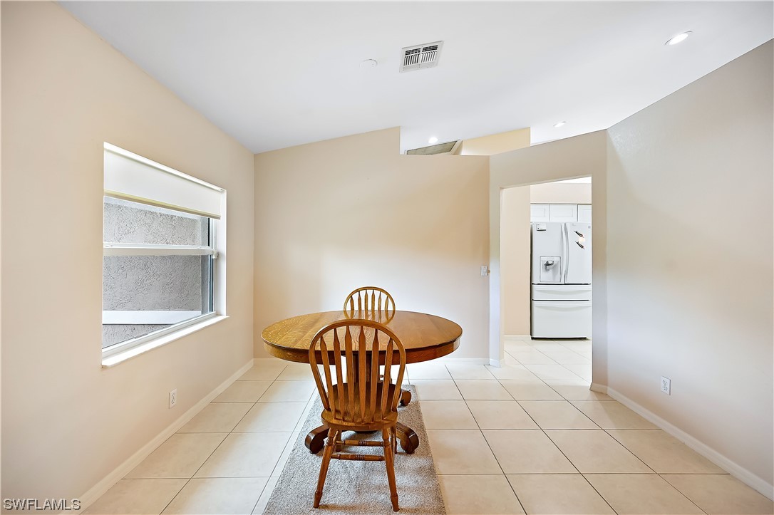 3535 18th Avenue Southeast Naples, FL 34117 - Photo 7 of 32 a dining room with furniture and window