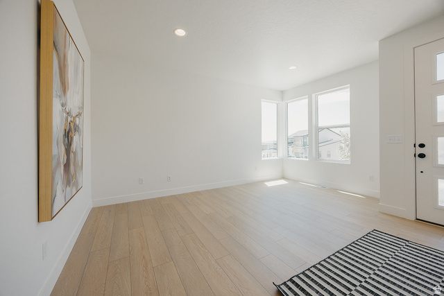 5902 Canyon Rim Road, Unit 620 Lehi, UT 84048 - Photo 70 of 78 Bright interior space featuring light wood-finish flooring, recessed lighting, and white baseboards