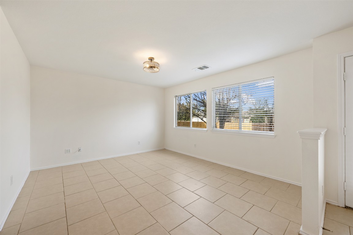 15216 Mandarin Crossing Pflugerville, TX 78660 - Photo 18 of 40 Spare room with light tile patterned flooring and baseboards