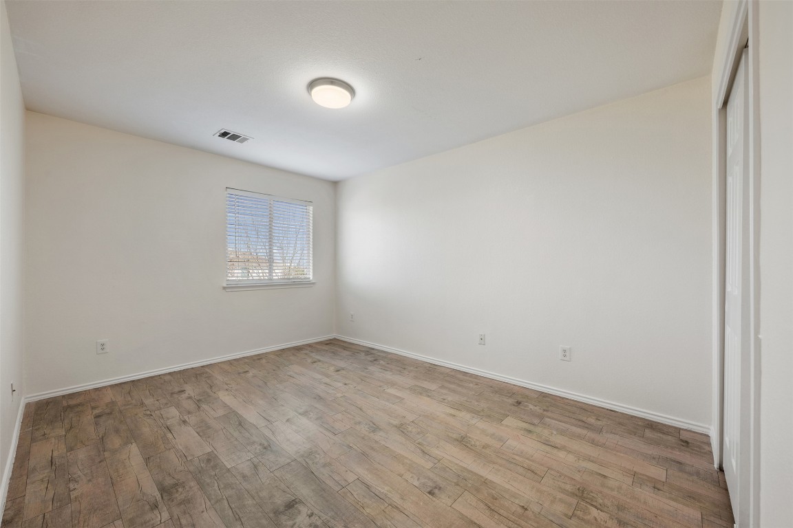15216 Mandarin Crossing Pflugerville, TX 78660 - Photo 24 of 40 Unfurnished room featuring light wood-style floors and baseboards
