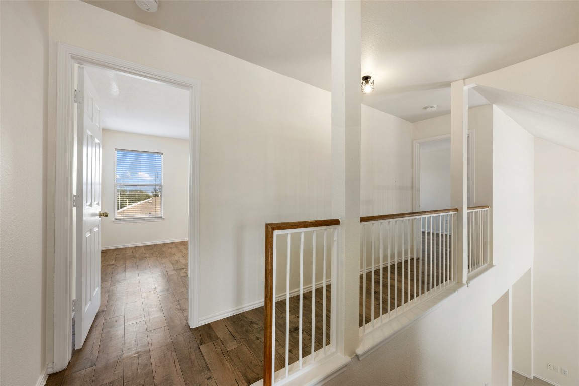 15216 Mandarin Crossing Pflugerville, TX 78660 - Photo 25 of 40 Hall with hardwood / wood-style flooring and baseboards