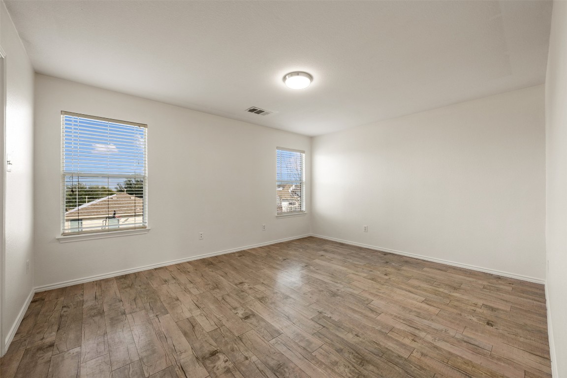 15216 Mandarin Crossing Pflugerville, TX 78660 - Photo 26 of 40 Unfurnished room with light wood-style flooring and baseboards
