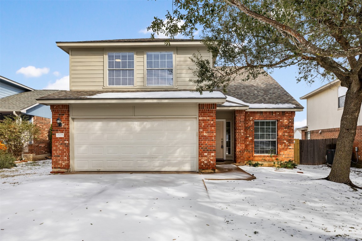 15216 Mandarin Crossing Pflugerville, TX 78660 - Photo 3 of 40 Traditional-style house featuring a garage, brick siding, concrete driveway, and roof with shingles