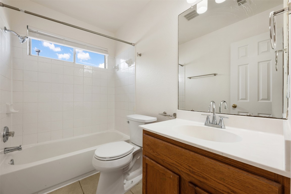 15216 Mandarin Crossing Pflugerville, TX 78660 - Photo 34 of 40 Full bath with vanity, bathing tub / shower combination, and light tile patterned floors