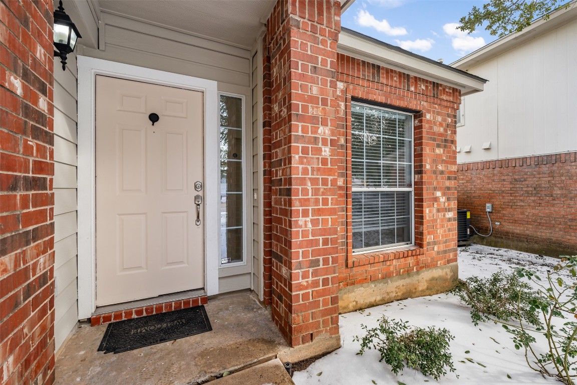 15216 Mandarin Crossing Pflugerville, TX 78660 - Photo 5 of 40 Entrance to property with brick siding