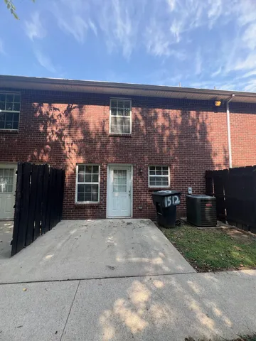 an outdoor view of house with yard