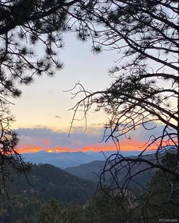 a view of mountain view with lots of trees