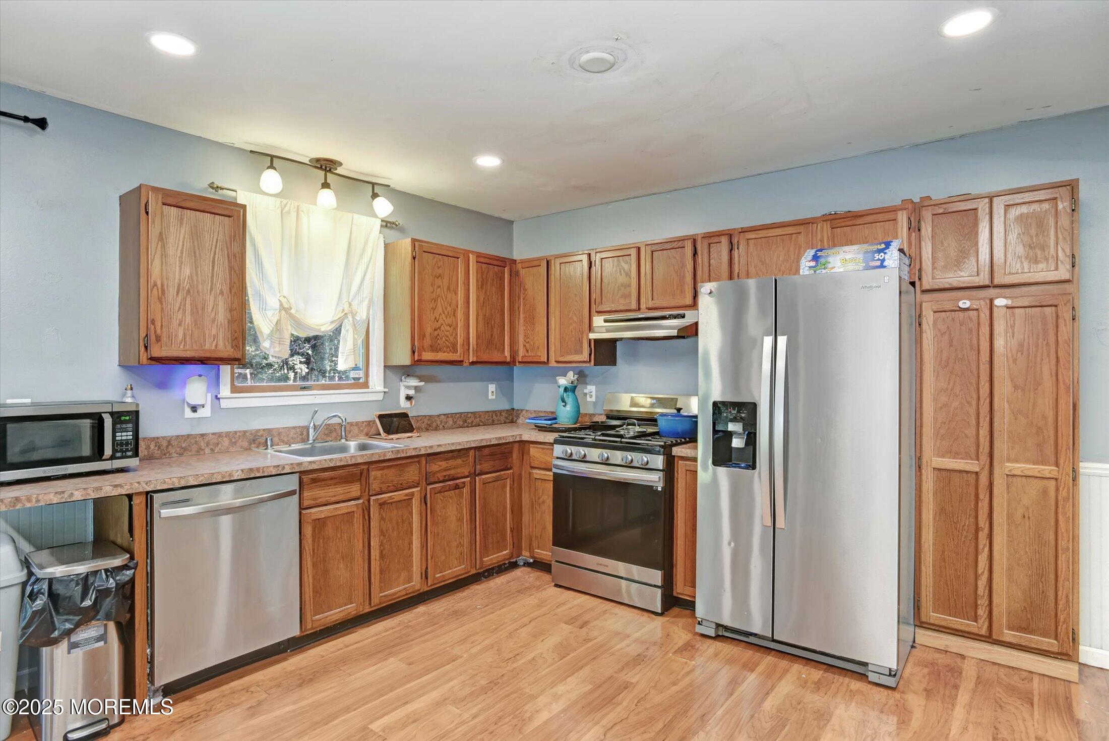 10 Bowman Road Jackson, NJ 08527 - Photo 12 of 32 a kitchen with stainless steel appliances granite countertop a refrigerator stove and sink