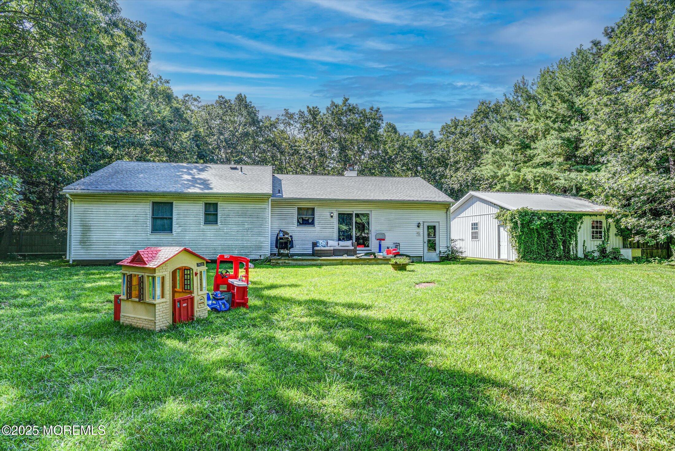 10 Bowman Road Jackson, NJ 08527 - Photo 26 of 32 a front view of house with yard and seating area