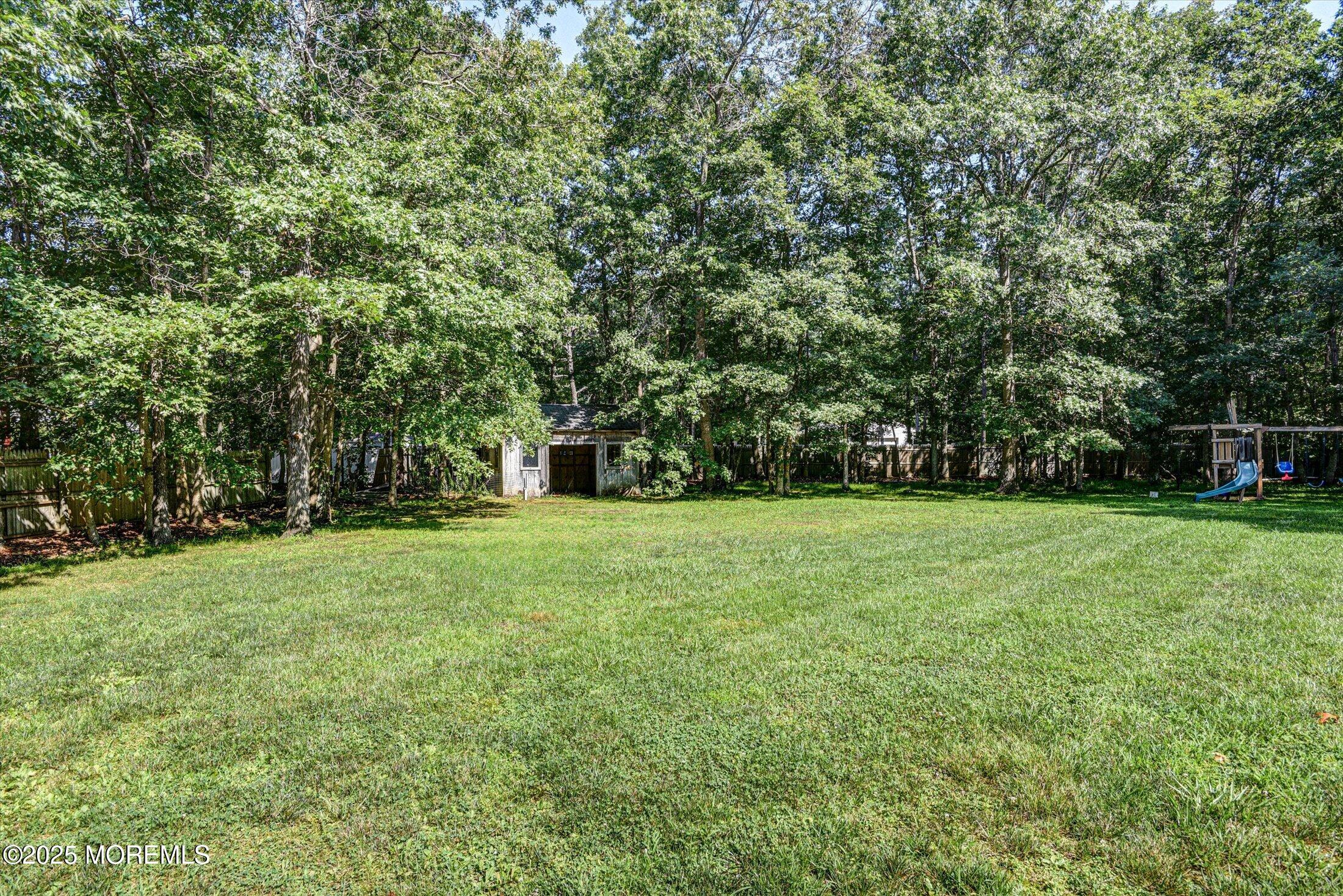 10 Bowman Road Jackson, NJ 08527 - Photo 28 of 32 a view of a field with trees in the background