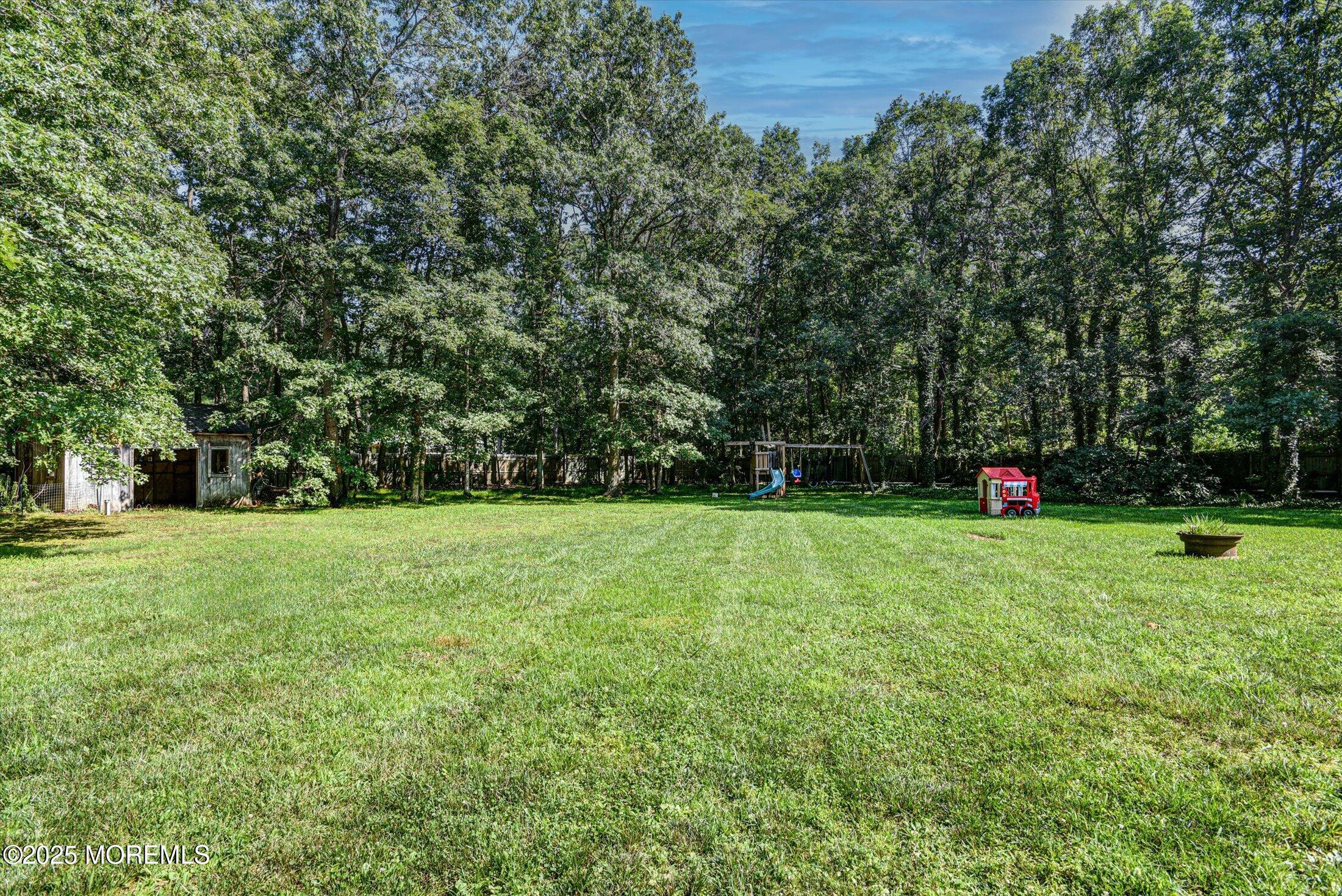 10 Bowman Road Jackson, NJ 08527 - Photo 29 of 32 a yard with trees in the background