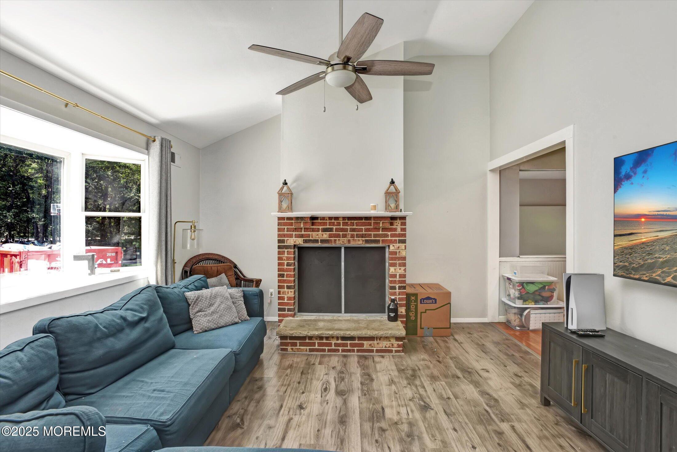10 Bowman Road Jackson, NJ 08527 - Photo 6 of 32 a living room with furniture and a fireplace