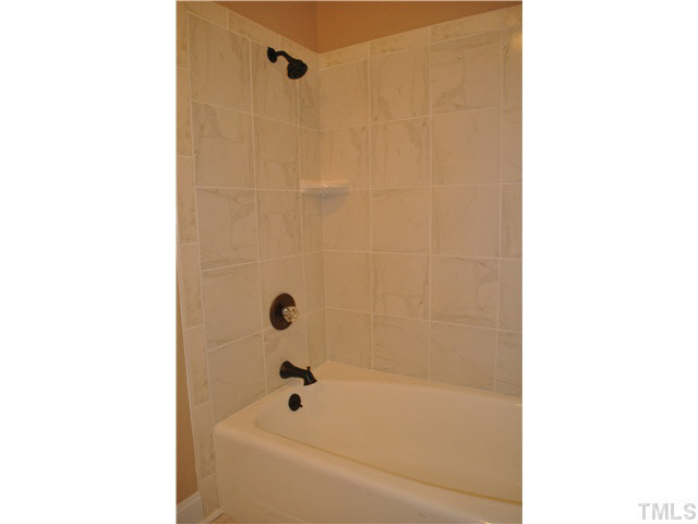4579 Barber Mill Road Clayton, NC 27520 - Photo 16 of 24 Hall Bath shower - new tile and fixtures