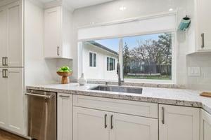 7106 Brooktree Way San Jose, CA 95120 - Photo 11 of 36 a kitchen with granite countertop a sink and a window