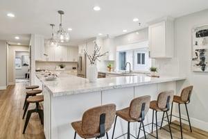 7106 Brooktree Way San Jose, CA 95120 - Photo 15 of 36 a kitchen with kitchen island granite countertop a dining table chairs cabinets and wooden floor