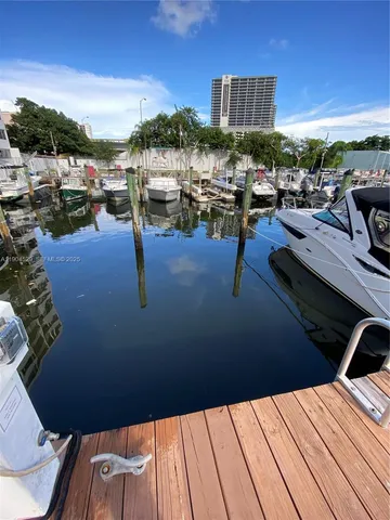 a view of roof deck with outdoor seating and city view