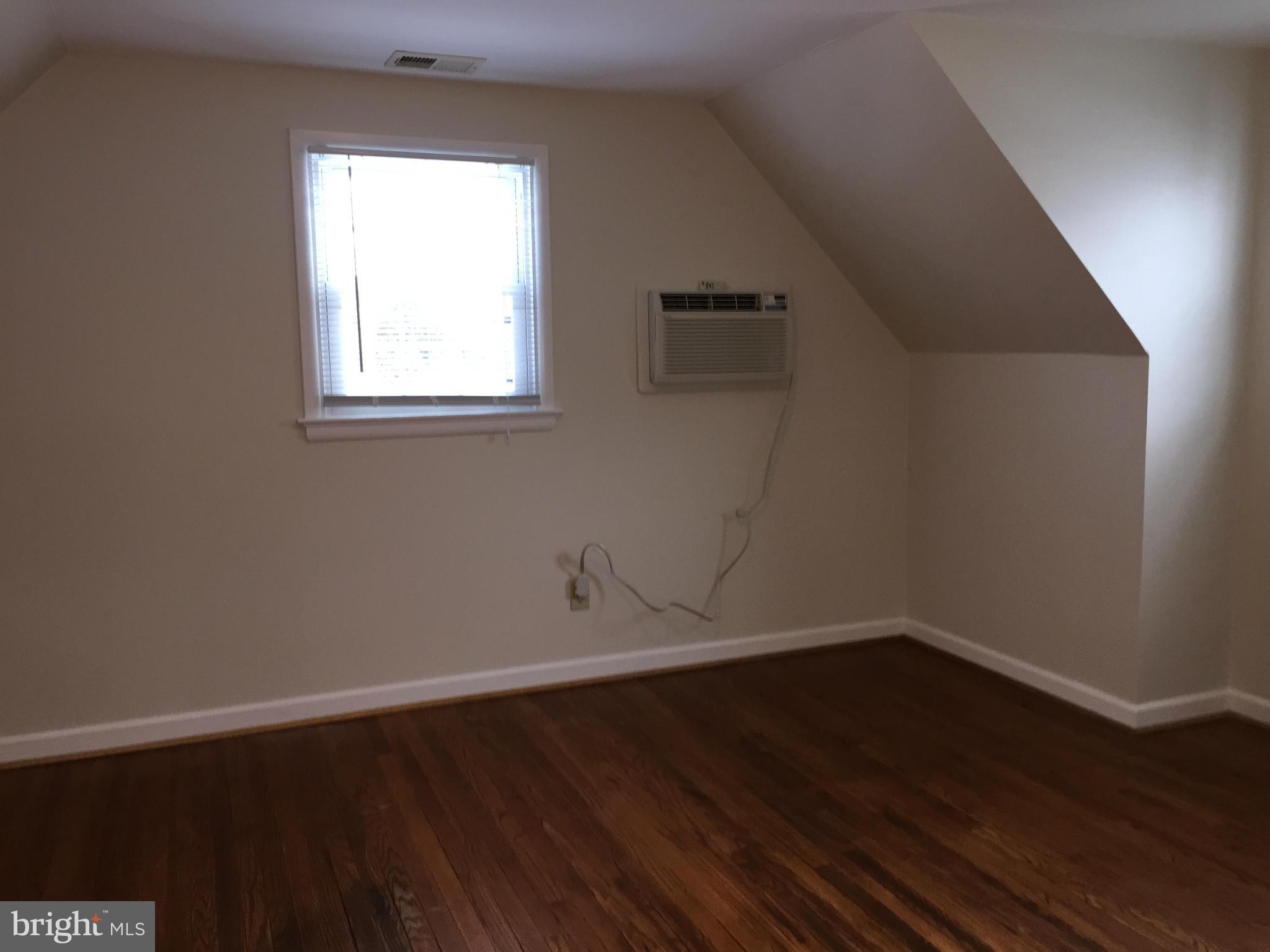 12601 Dean Road Silver Spring, MD 20906 - Photo 14 of 16 a view of a small space with wooden floor and a window