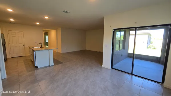 wooden floor and an empty room with a fireplace
